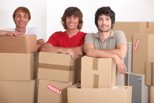 Worker assessing hazards before lifting heavy household items
