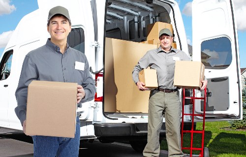 Packed boxes and furniture ready for loading during a local removal service