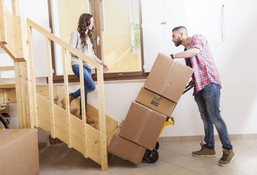 Final moving stage with boxes being placed in a new home