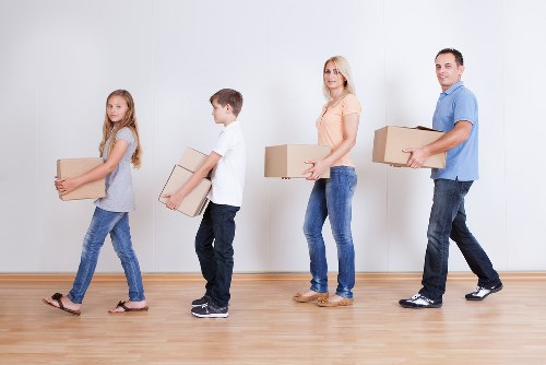 Professional man and van moving assistance in a London neighborhood