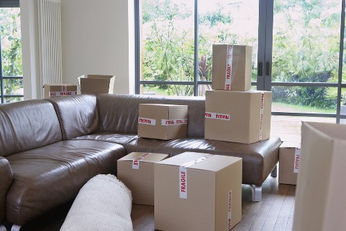 Careful packing of household items in a North London flat