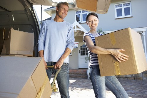 Moving boxes, wrapped furniture, and essentials organised for a home relocation