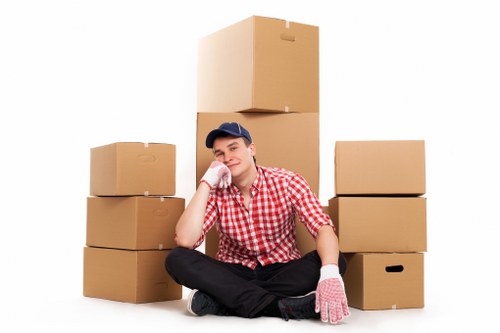 A removals team handling desks and office items in a Tufnell Park property